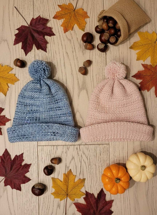 Mostra i prodotti: berretto blu di lana e berretto rosa di lana