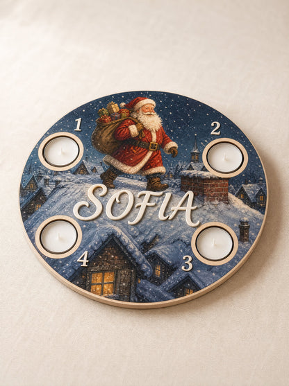 Corona dell'Avvento tema Babbo Natale sui tetti innevati con il sacco dei regali e il comignolo