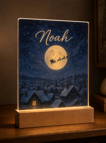 Scena La slitta di Babbo Natale con le renne sotto la luna piena, nome Noah tra le stelle