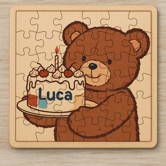 Puzzle di un orso che tiene in mano una torta di compleanno